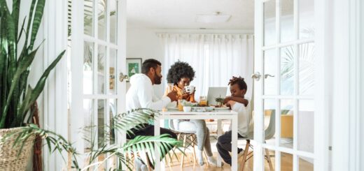 people sitting on chairs in front of table